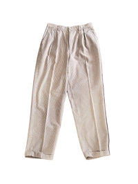 Houndstooth brown pleated pants on a white background