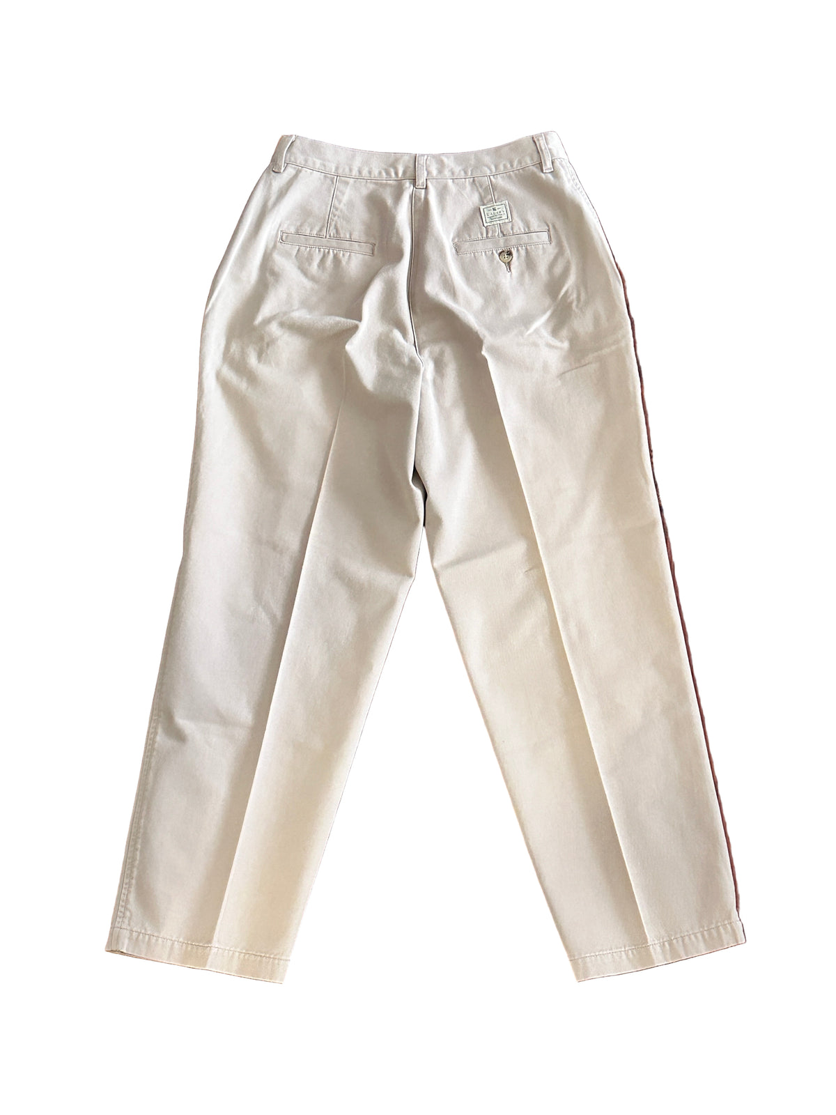 Back of beige pants on a white background