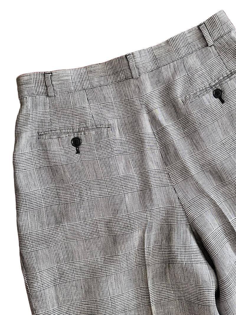 Black and white houndstooth pants on a white background