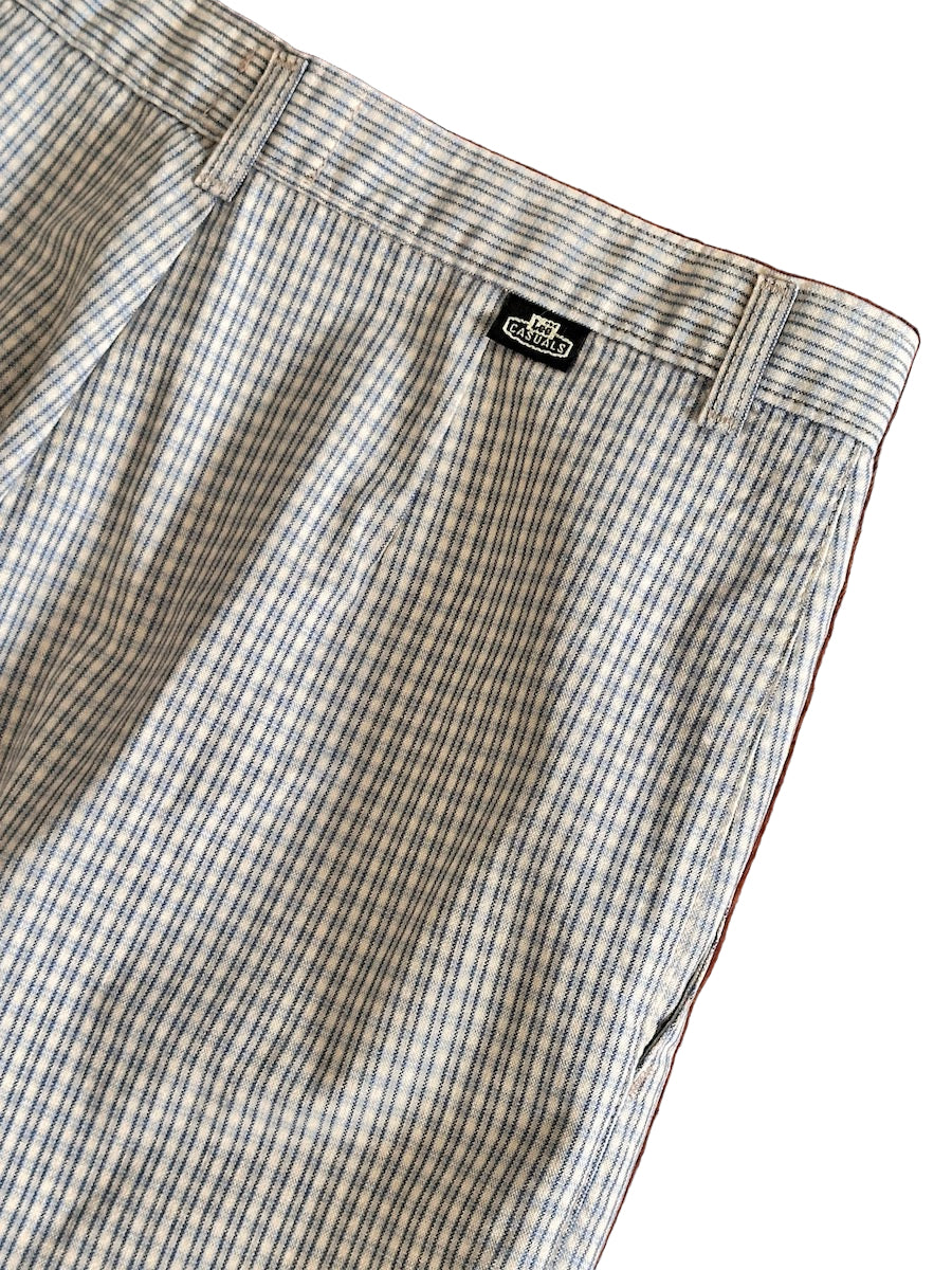 Plaid pants with a brand logo on a white background