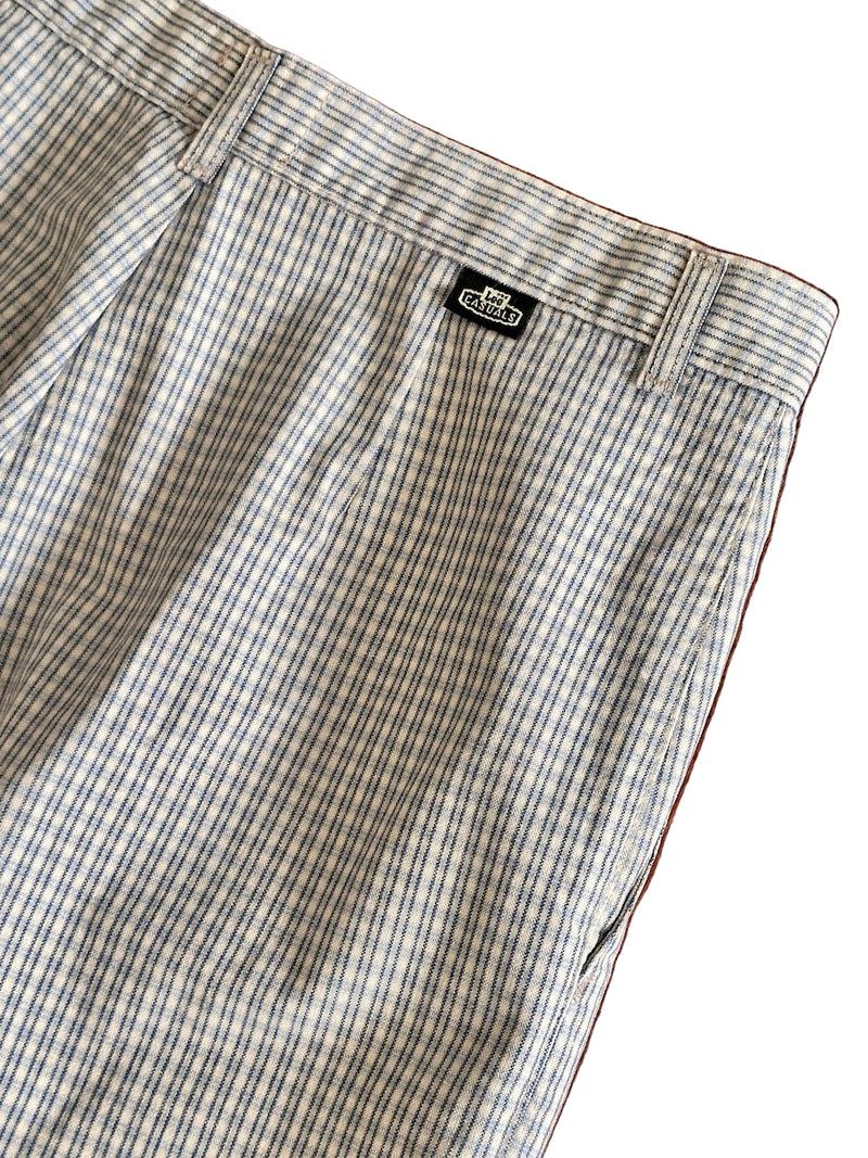 Plaid pants with a brand logo on a white background