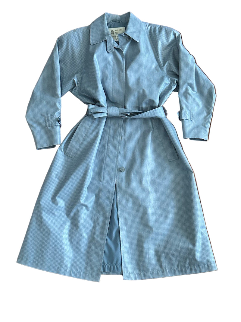 Light blue trench coat on a white background