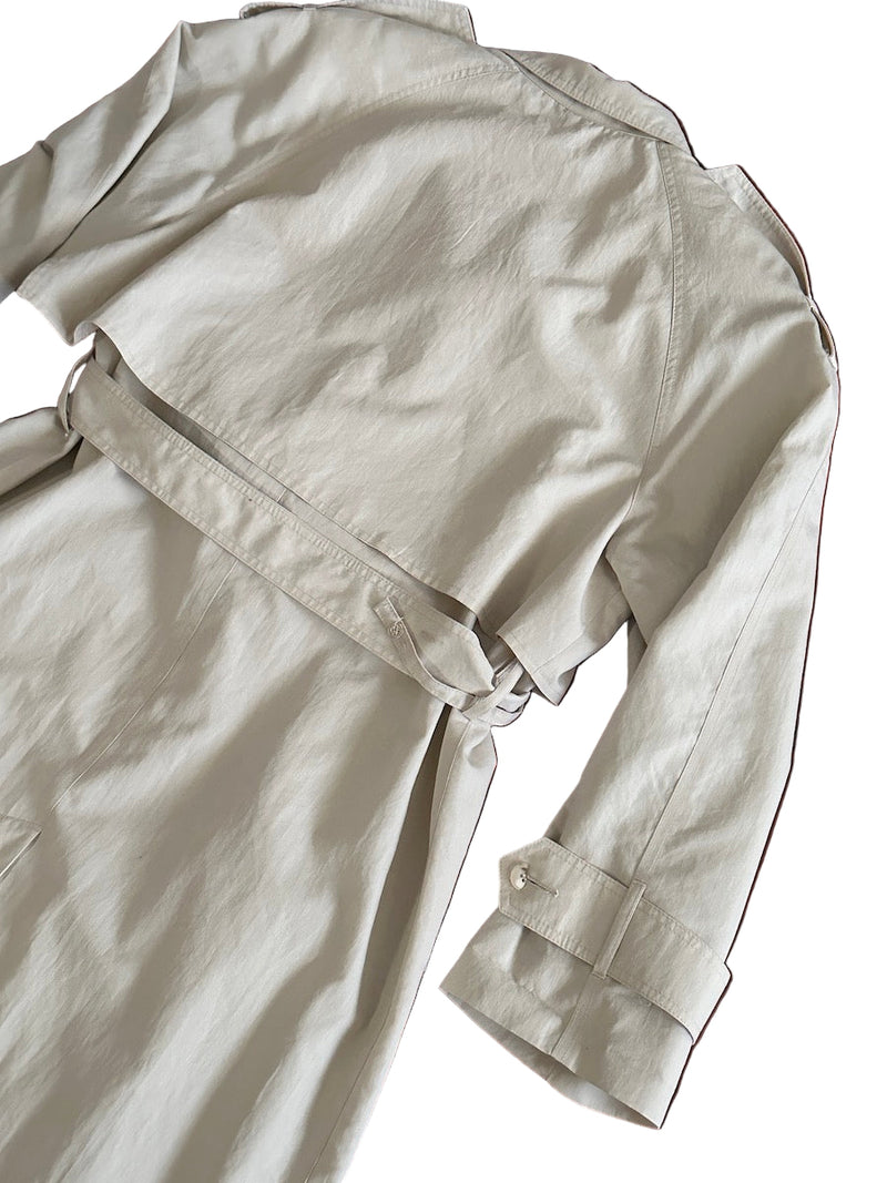 Back of off-white trench coat on a white background