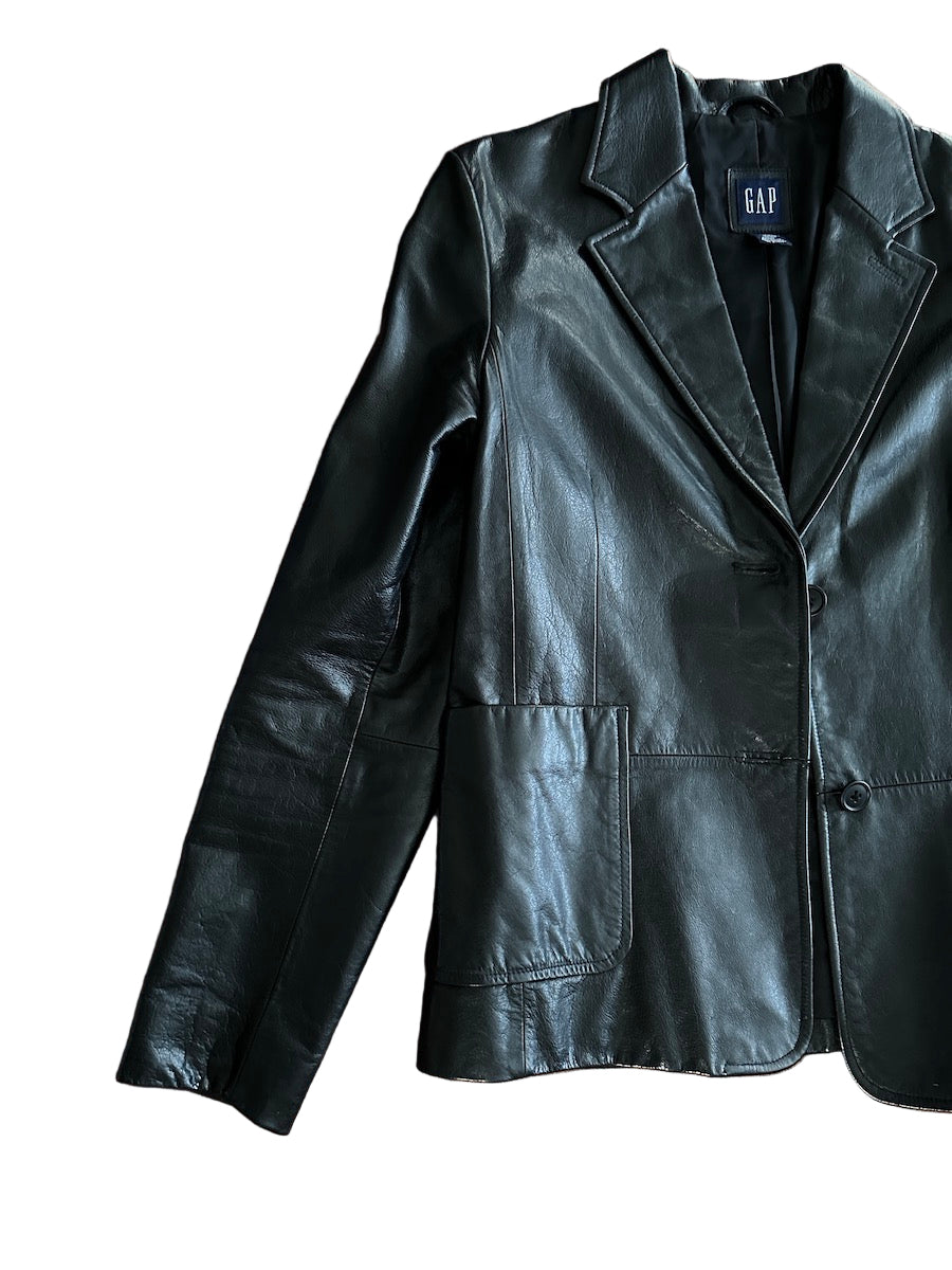 Black leather jacket on a white background with 'GAP' branding.