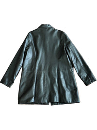 Chocolate brown leather coat on a wooden surface