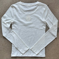 White long-sleeve shirt on a gray background