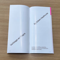 Open magazine on a wooden surface with text about 'Verbiage as Viagra' by Edwin Heathcote.