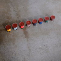 Row of candles on a concrete surface