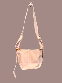 Pink canvas bag with long strap and jade beads
