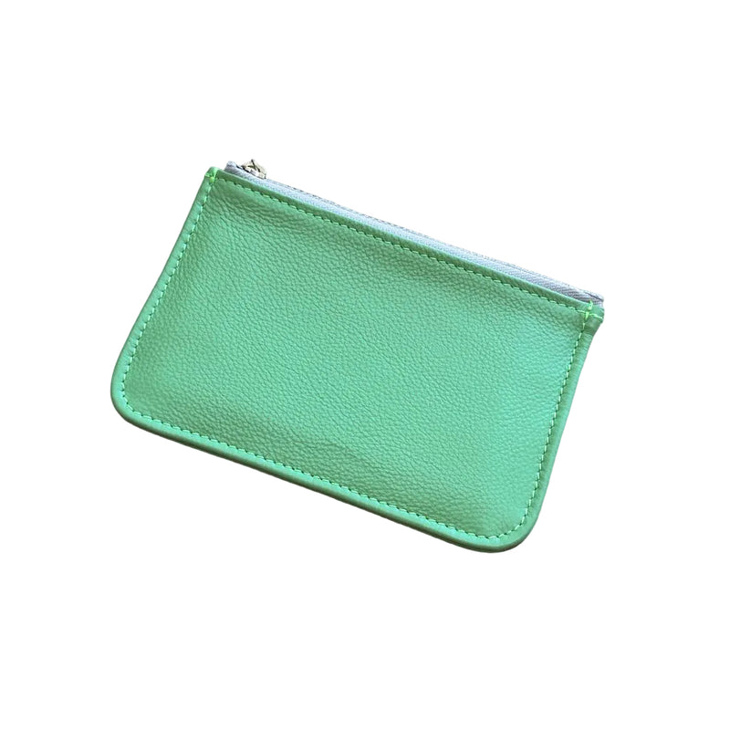 Green leather pouch on a white background