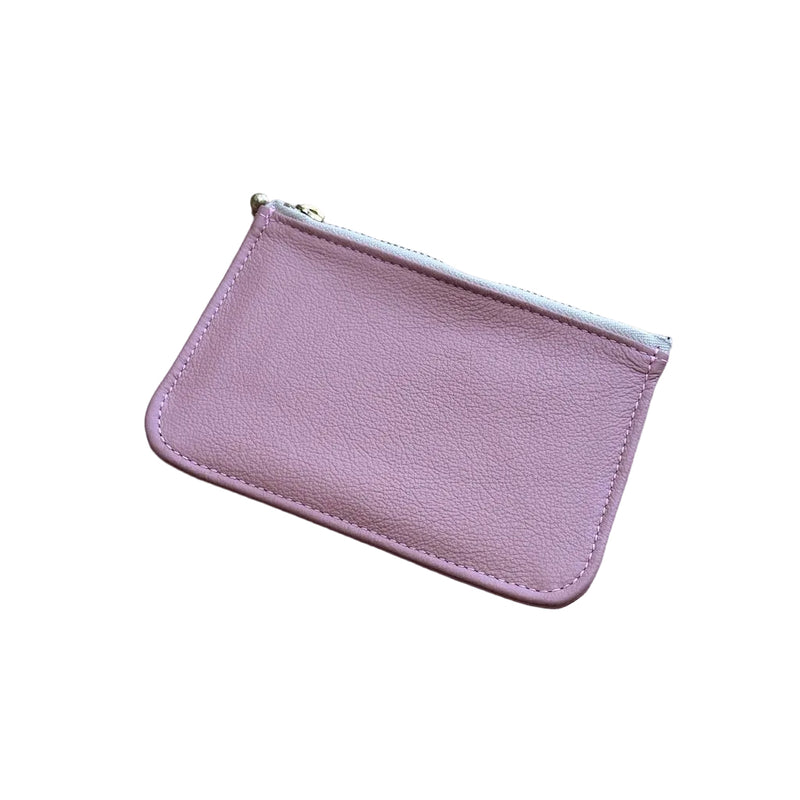 Pink leather pouch on a white background