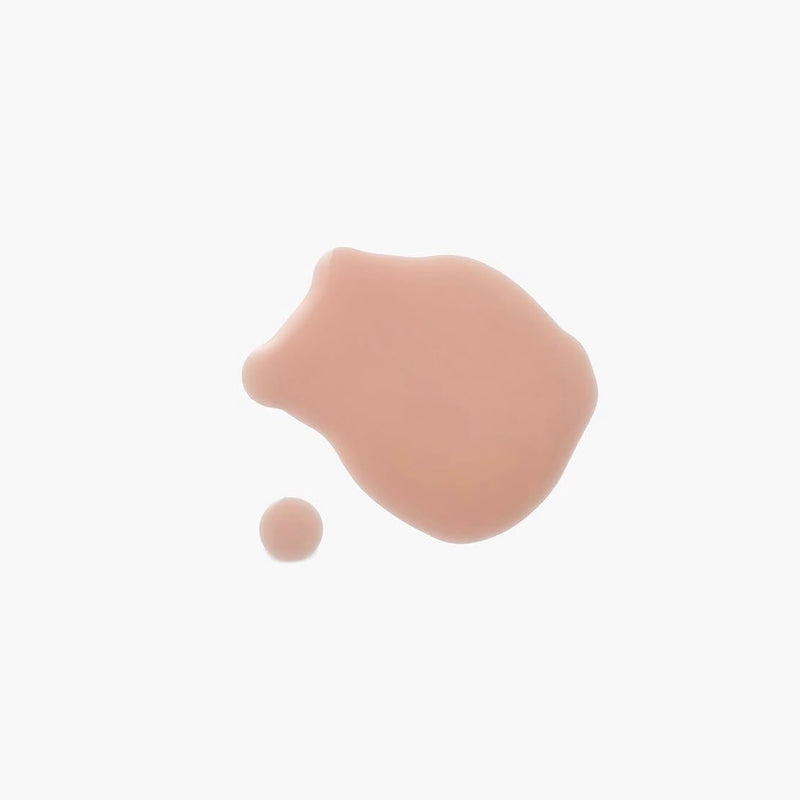 Beige nail polish liquid spot on a white background