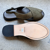 Top and bottom view of green suede and leather sandals by Rachel Comey