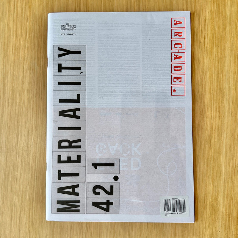 A magazine or book cover titled 'MATERIALITY 42.1' with 'ARCADE' in red block letters, photographed flat on a light wood surface.