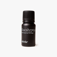A small black bottle of Vörda Eucalyptus Plus Essential Oil Single, featuring a ribbed black cap and white text, set against a clean white background.