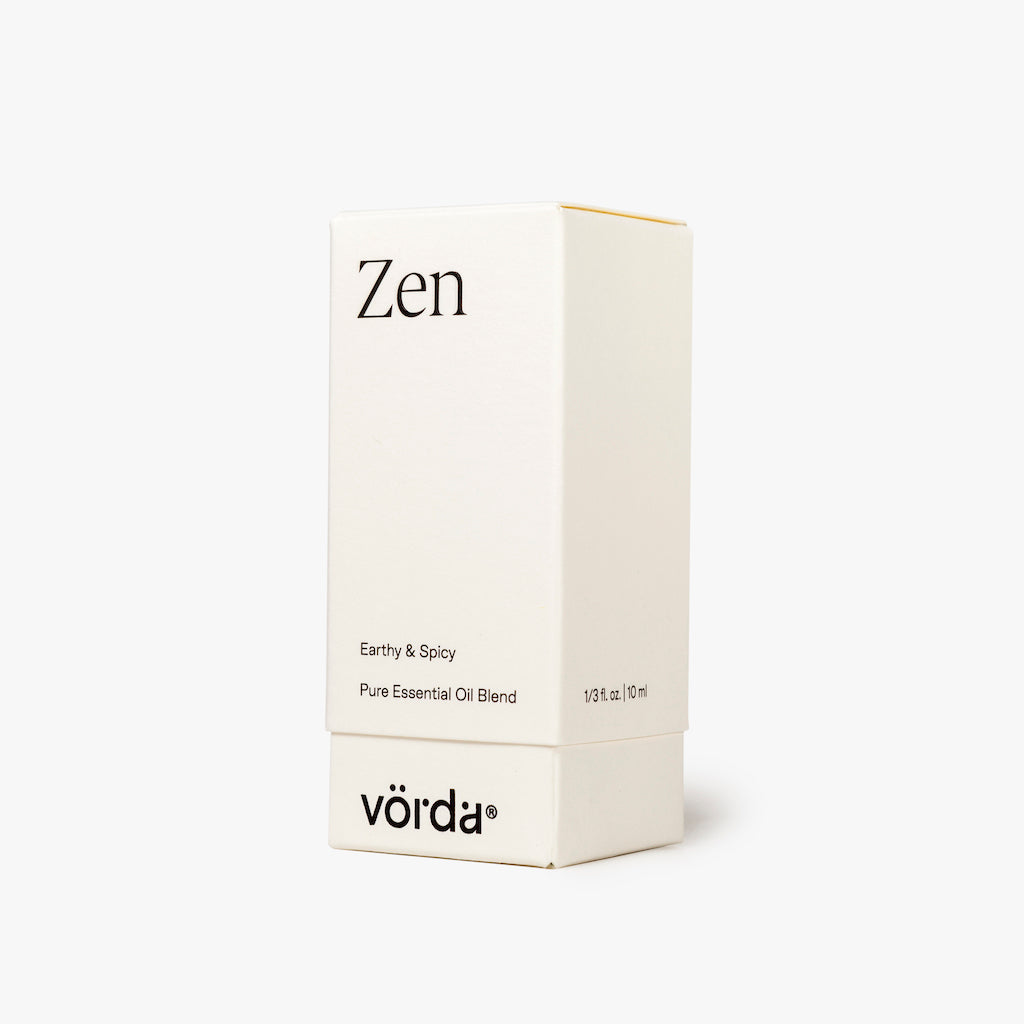 A minimalist white rectangular box for Vörda Zen pure essential oil blend, featuring black text, set against a clean white background.
