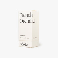 A white rectangular box for Vörda French Orchard essential oil, featuring black text on a clean white background.