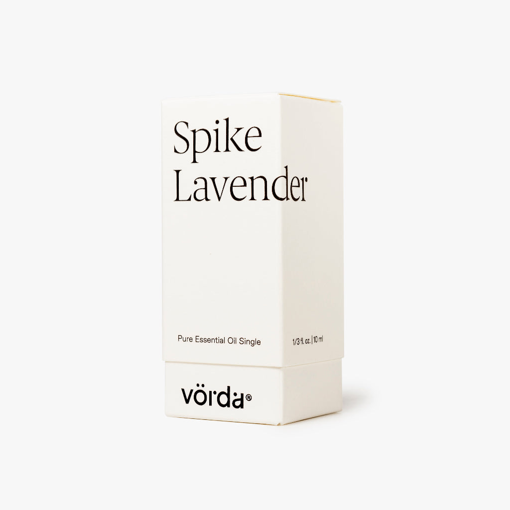 A minimalist white box for Vörda Spike Lavender essential oil, featuring black text on a clean white background.