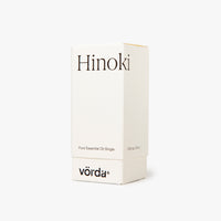 A white rectangular box for Vörda Hinoki pure essential oil single, featuring black text on a clean white background.
