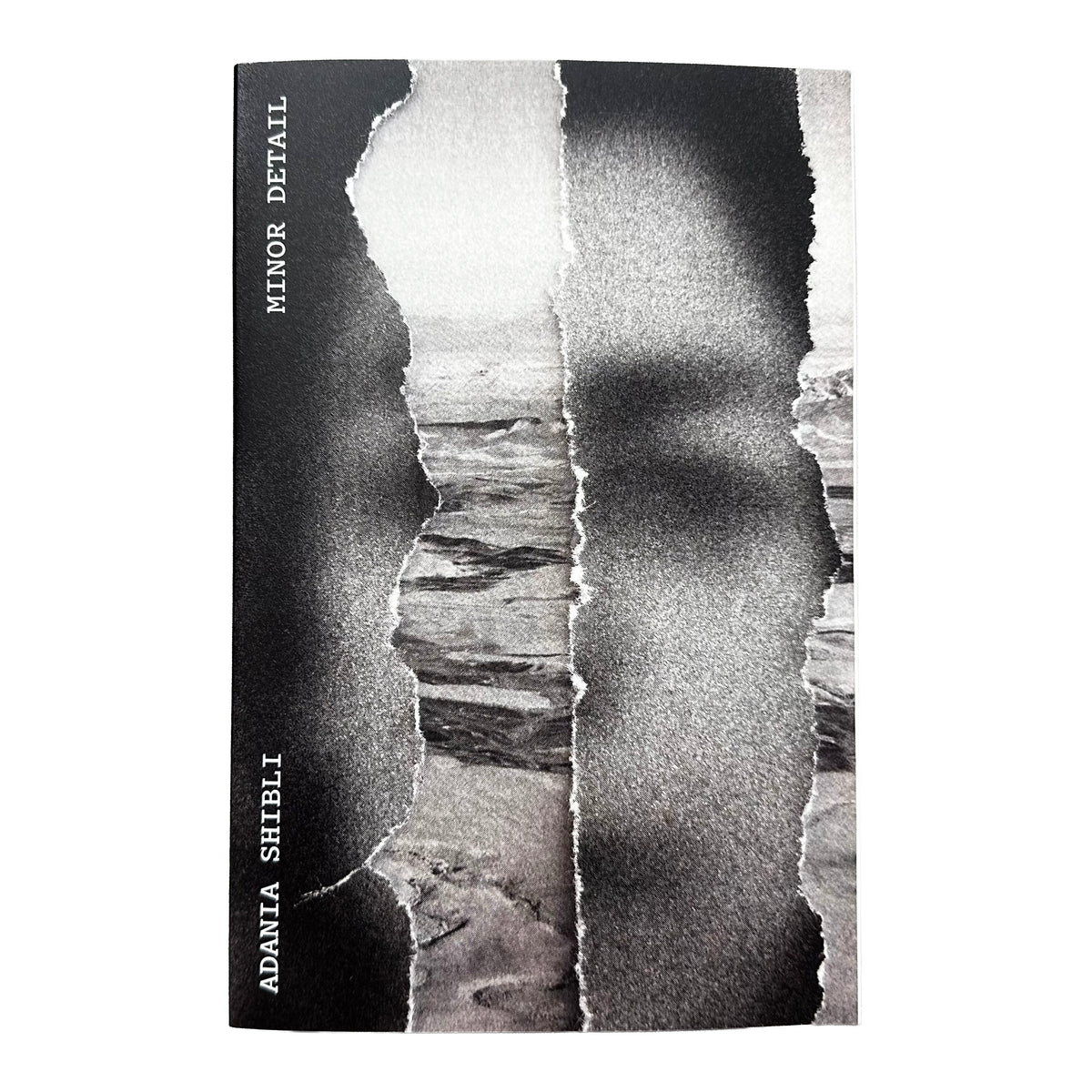 A book cover featuring a black-and-white torn-paper collage over a land scene and a blurred face. The left edge is black with vertical white text reading 'MINOR DETAIL' and 'ADANIA SHIBLI'.