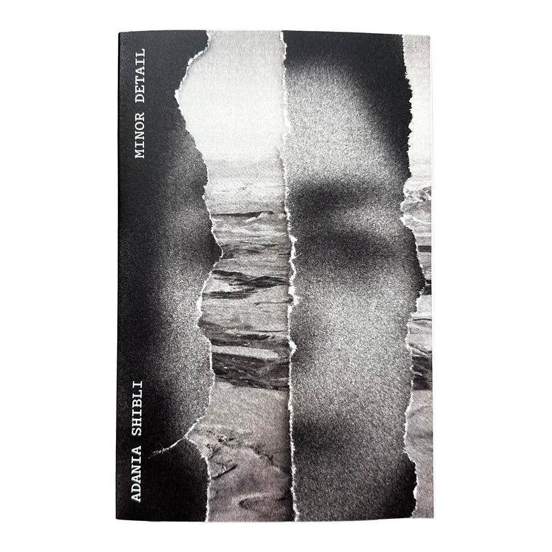 A book cover featuring a black-and-white torn-paper collage over a land scene and a blurred face. The left edge is black with vertical white text reading 'MINOR DETAIL' and 'ADANIA SHIBLI'.