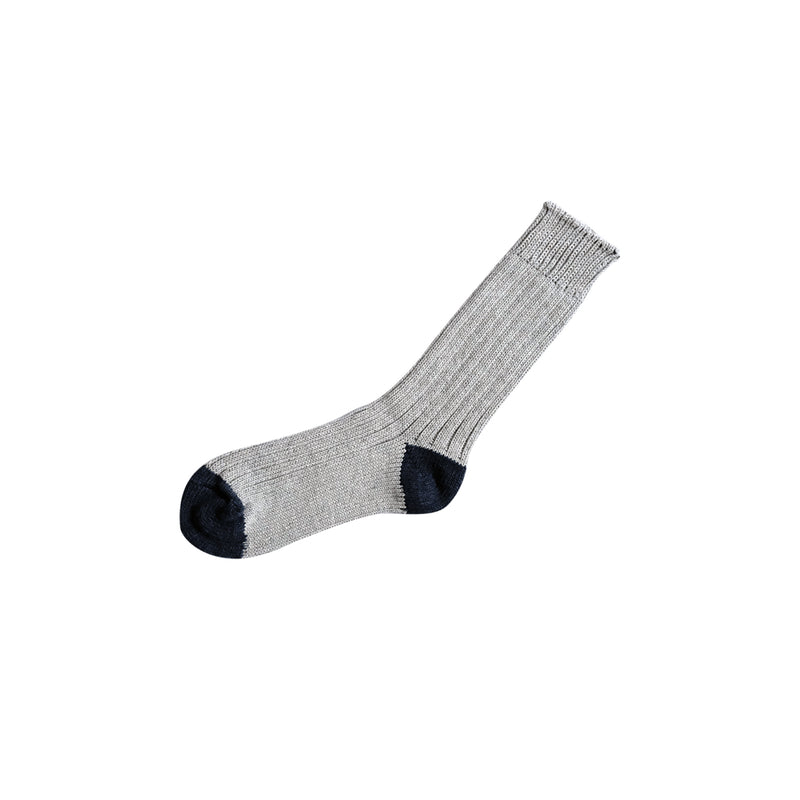 Gray sock with black toe and heel on a white background