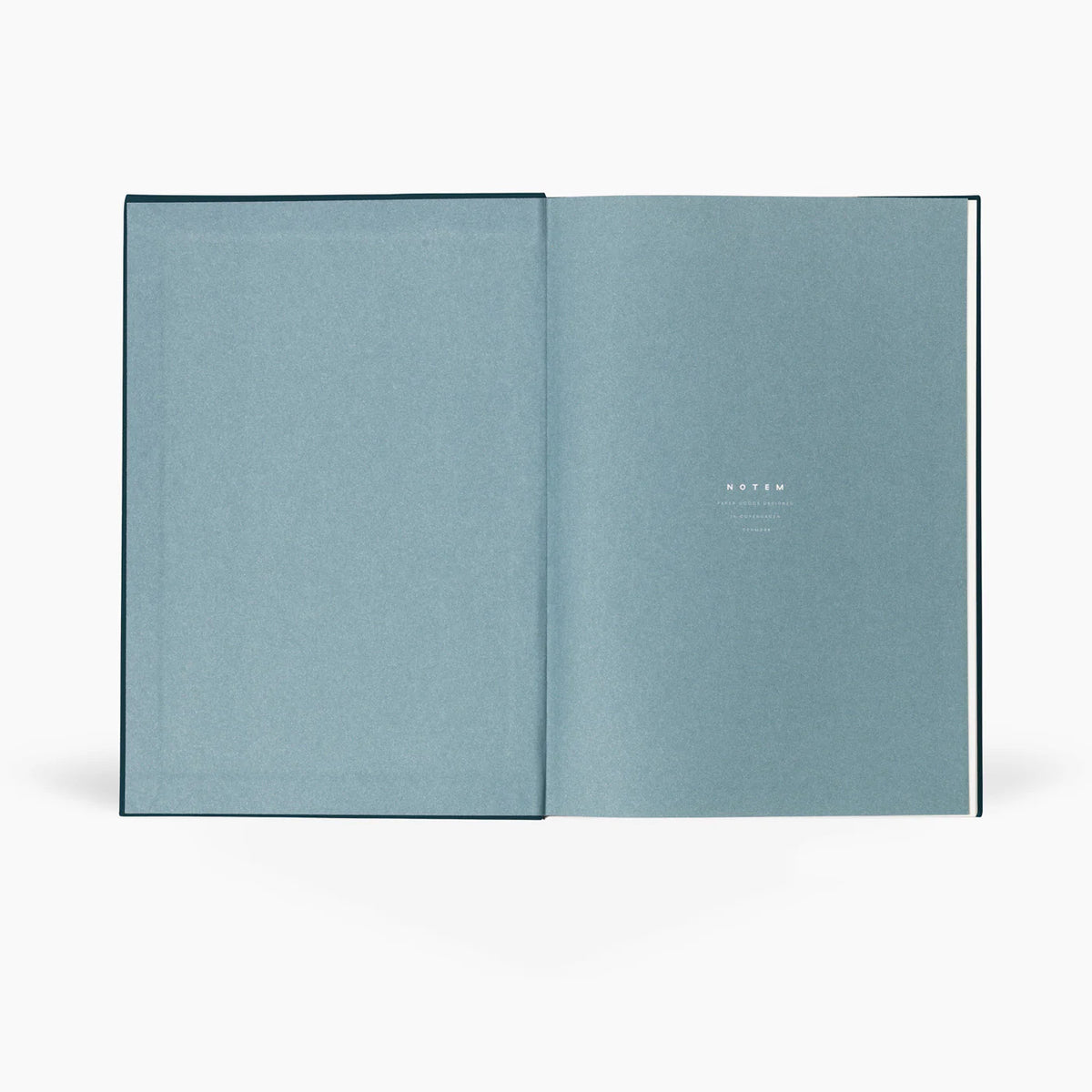 Open light blue page of a book on a white background
