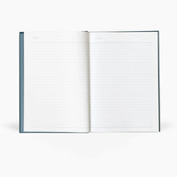 Open notebook with lined pages on a white background