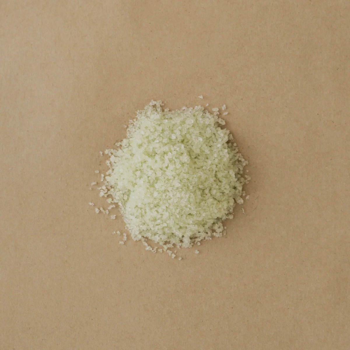 Closeup of a round cluster of salt bath soak on a Kraft paper background