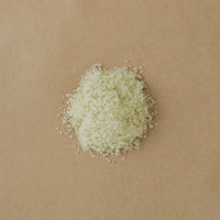 closeup of a round cluster of bath salts on a Kraft paper background