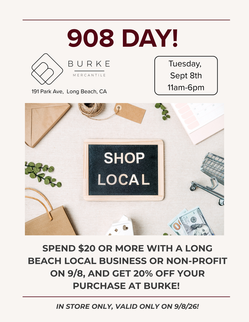 Promotional flyer for Burke Mercantile featuring a 20% off 'Shop Local' offer on Tuesday, Sept 8th from 11am-6pm. The flyer includes a central flat-lay photo of a small chalkboard sign reading 'SHOP LOCAL' surrounded by shopping bags, a dollar bill, and greenery, with store details and text at the top and bottom.