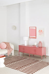 Modern living room with pink furniture and decor