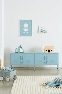 Light blue locker-style cabinet in a room with toys and decor.