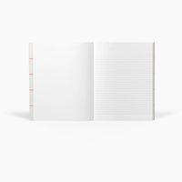 Open notebook with lined pages on a white background