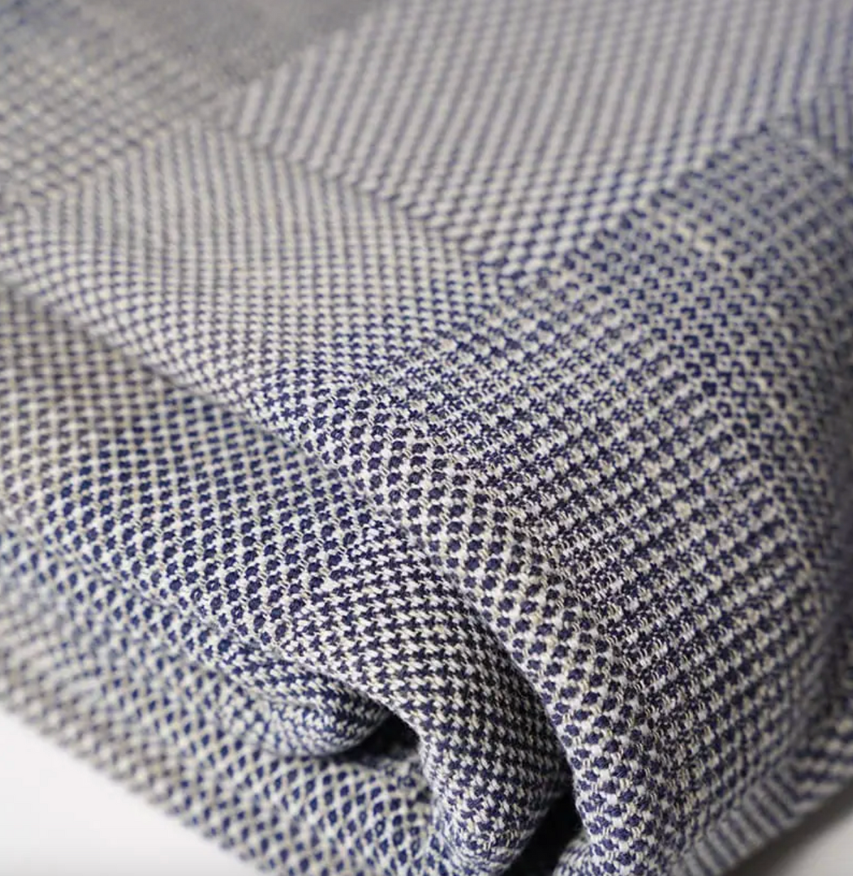 Close-up of textured fabric with a blue and white pattern