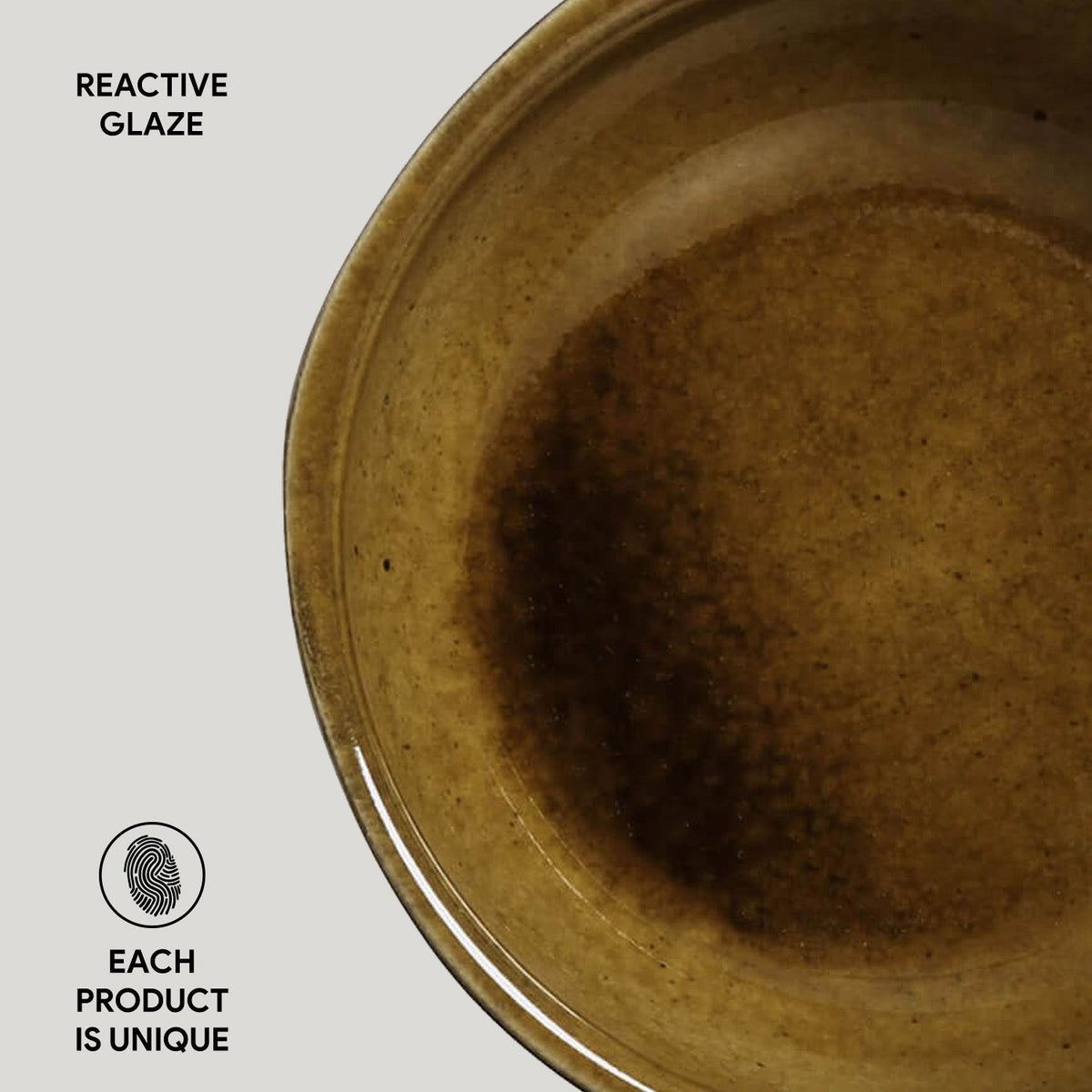 Brown ceramic plate with reactive glaze on a white background