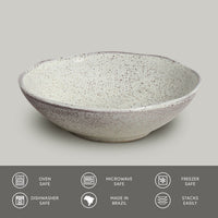 Speckled ceramic bowl on a light gray background with safety and feature icons at the bottom.