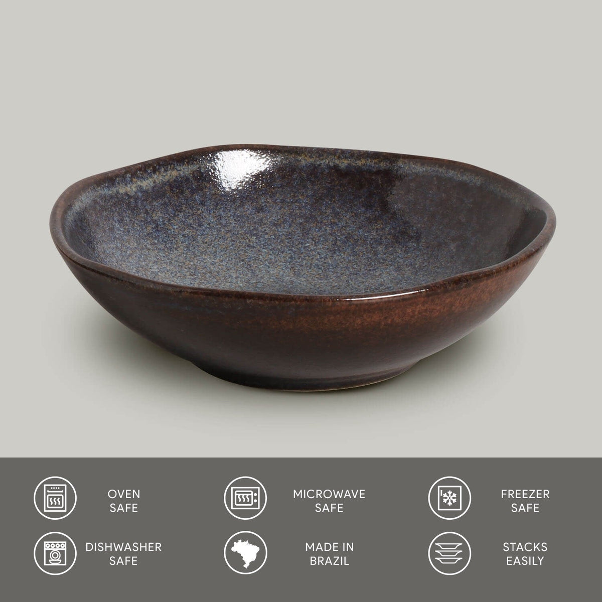 Ceramic bowl with speckled design on a gray background