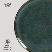 Close-up of a ceramic plate with reactive glaze on a white background