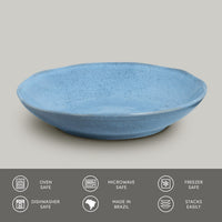 Blue ceramic bowl on a gray background with safety and feature icons at the bottom.