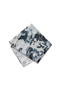 Tie-dye patterned napkin folded on a white background
