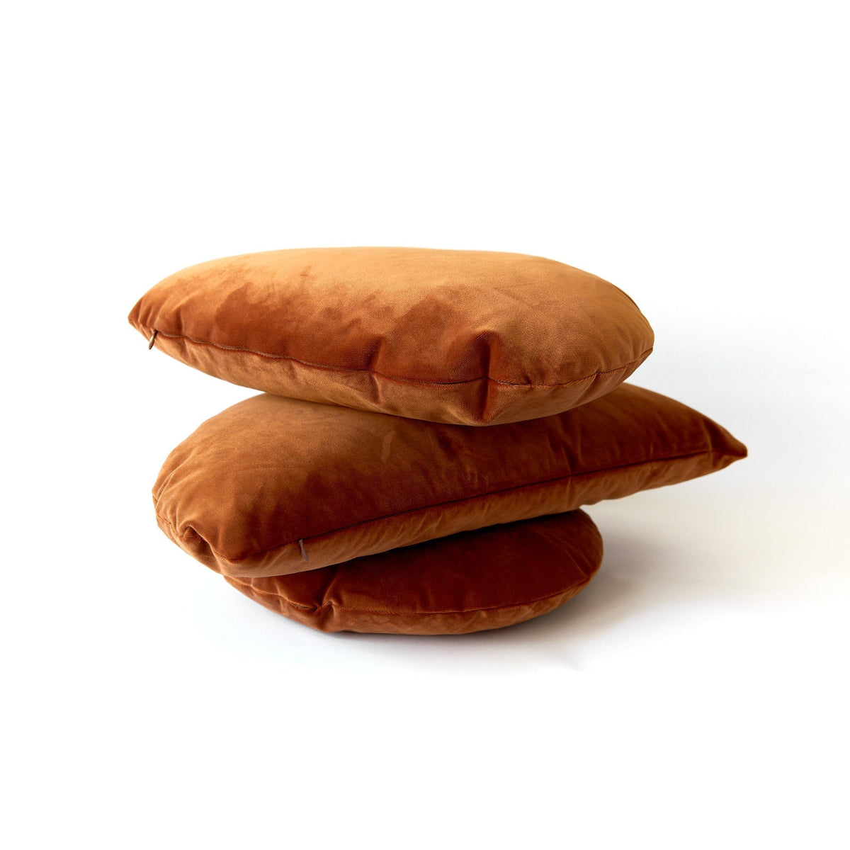 Stack of brown pillows on a white background