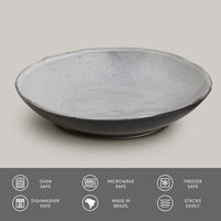 Gray ceramic pasta plate on a light gray background with safety and feature icons at the bottom.
