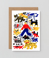 Greeting card with colorful illustrations of a person and various dogs on a white background.