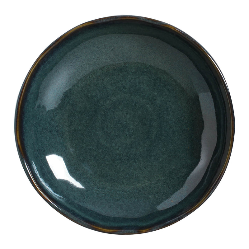Teal ceramic plate on a white background