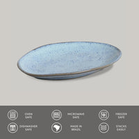 Blue ceramic plate on a gray background with safety and feature icons at the bottom.