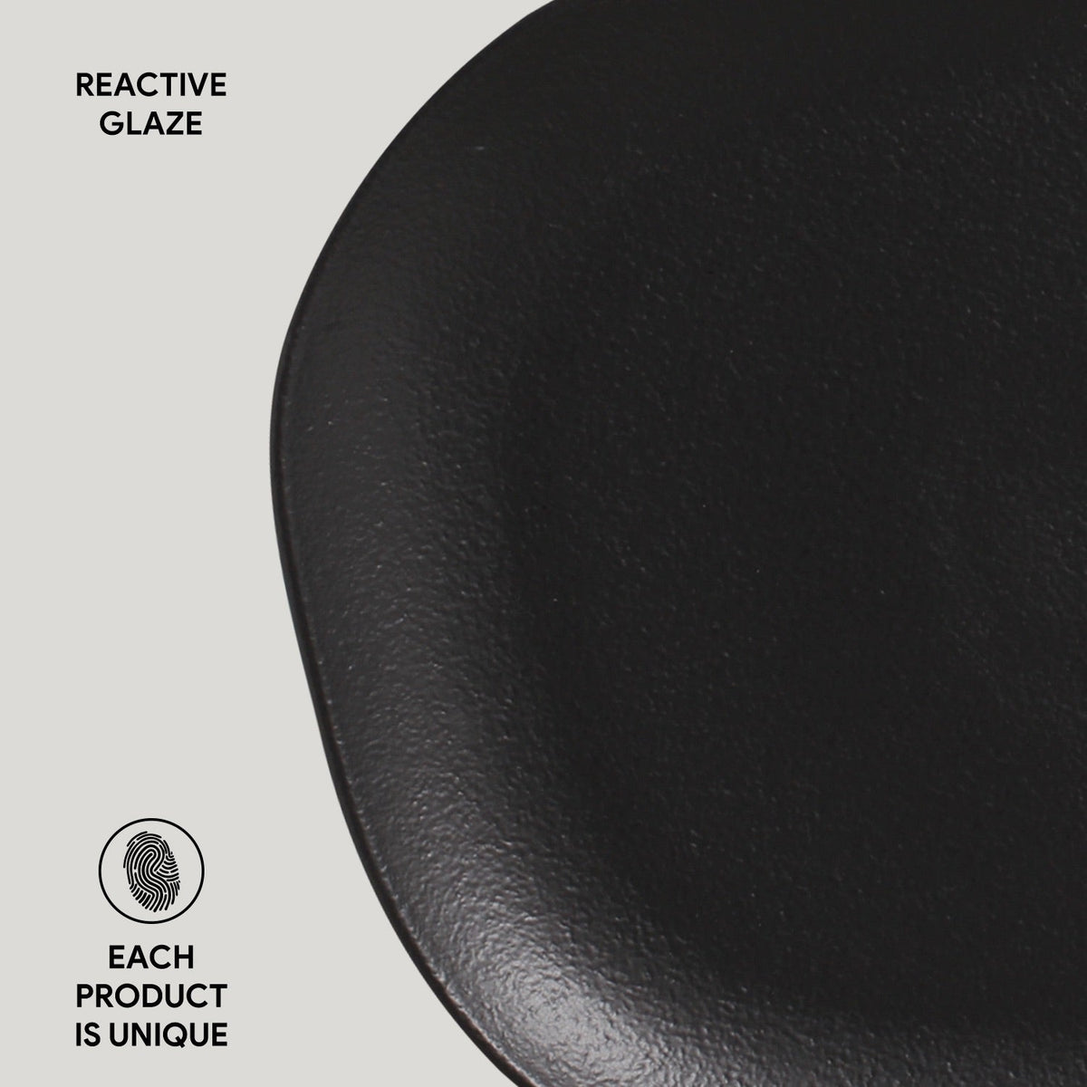 Black ceramic plate with 'Reactive Glaze' text and 'Each Product is Unique' label on a light gray background