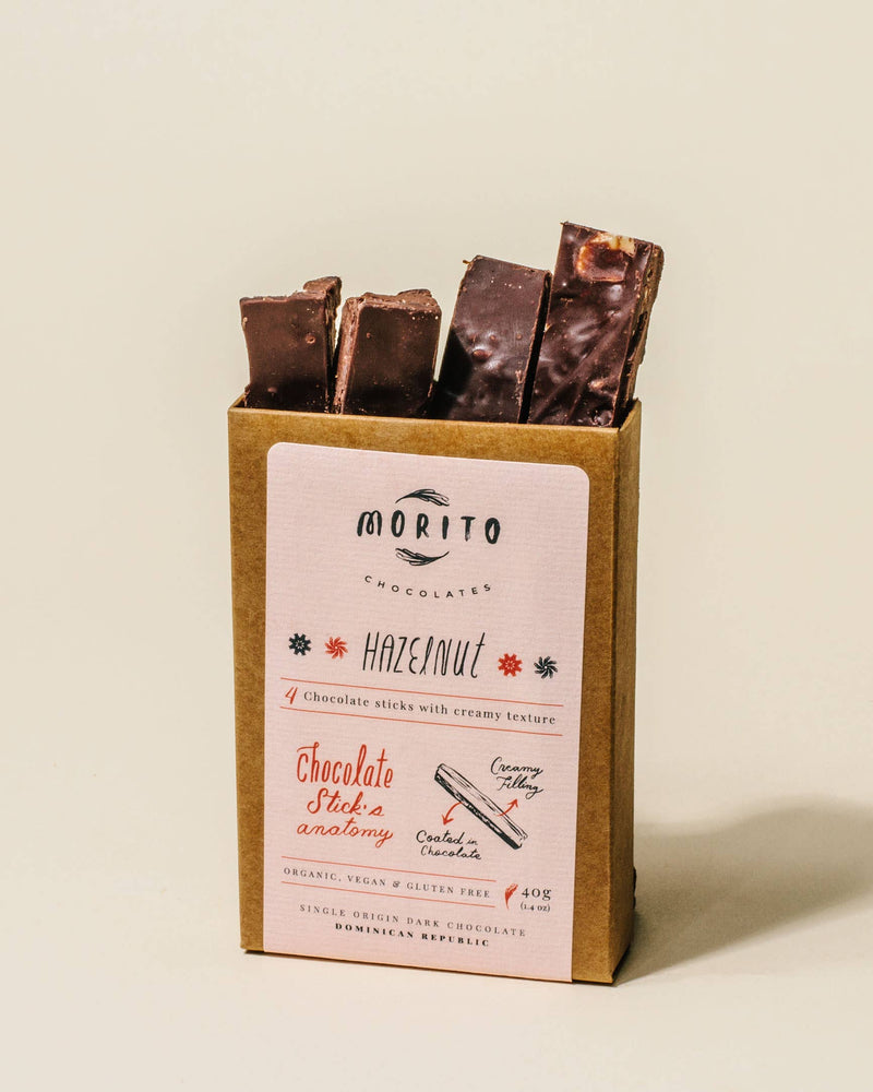 Morito Chocolates hazelnut chocolate sticks in a cardboard box on a beige background