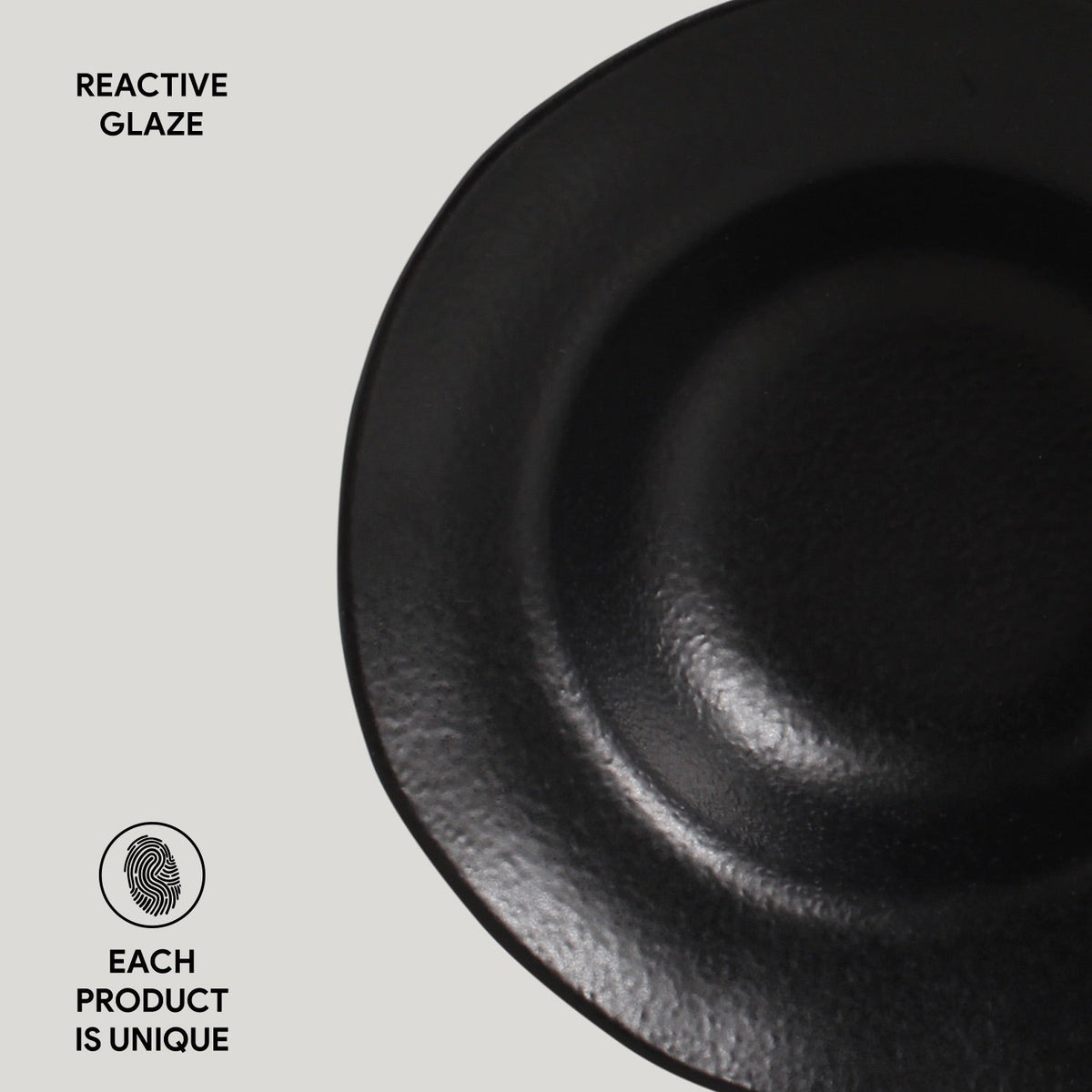 Black ceramic plate with 'Reactive Glaze' text and 'Each Product is Unique' label on a light gray background