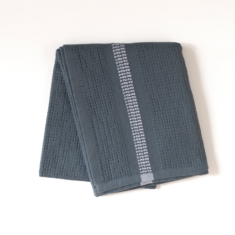 Folded blue hand towel with a white stripe